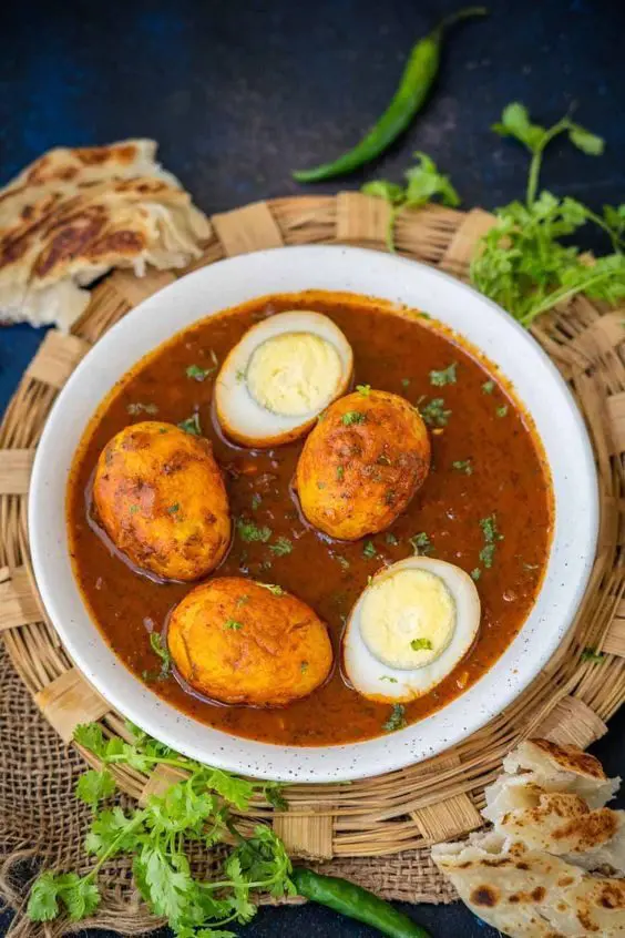 A bowl of food with some eggs in it