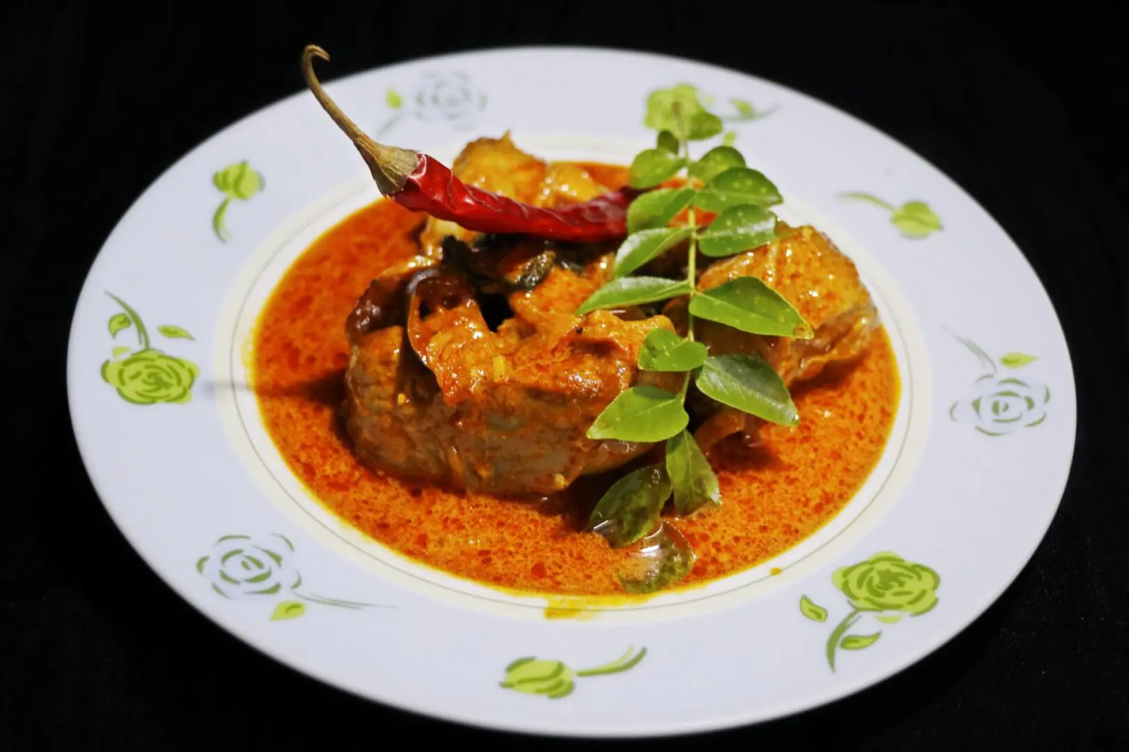 A plate of food with some meat and vegetables on it